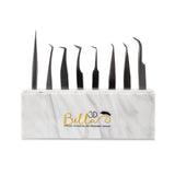 Acrylic Tweezer Stand holding nine different precision tweezers with a marble base and Bella 3D logo