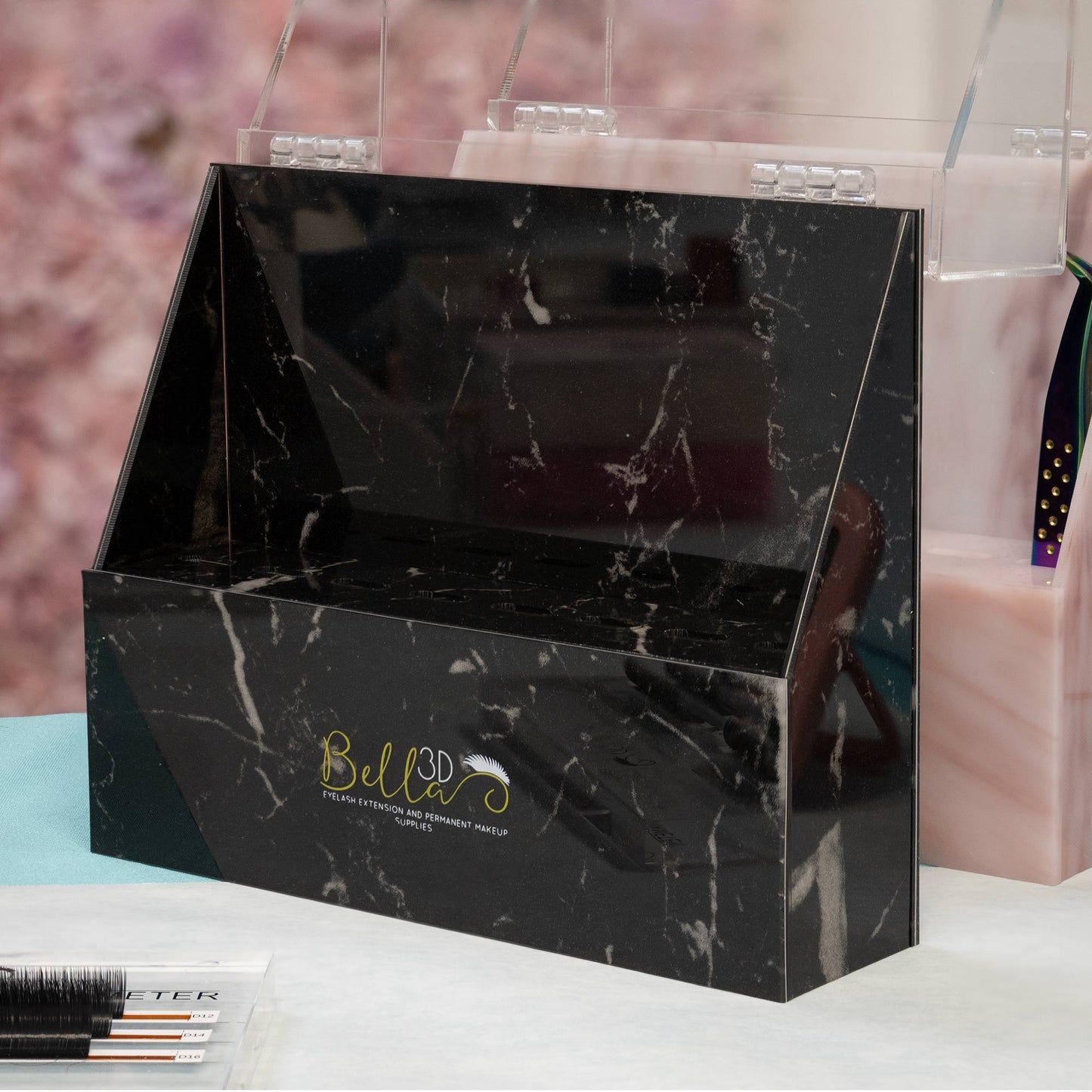 Acrylic Tweezer Stand in black marble pattern with Bella 3D logo for organizing eyelash extension accessories