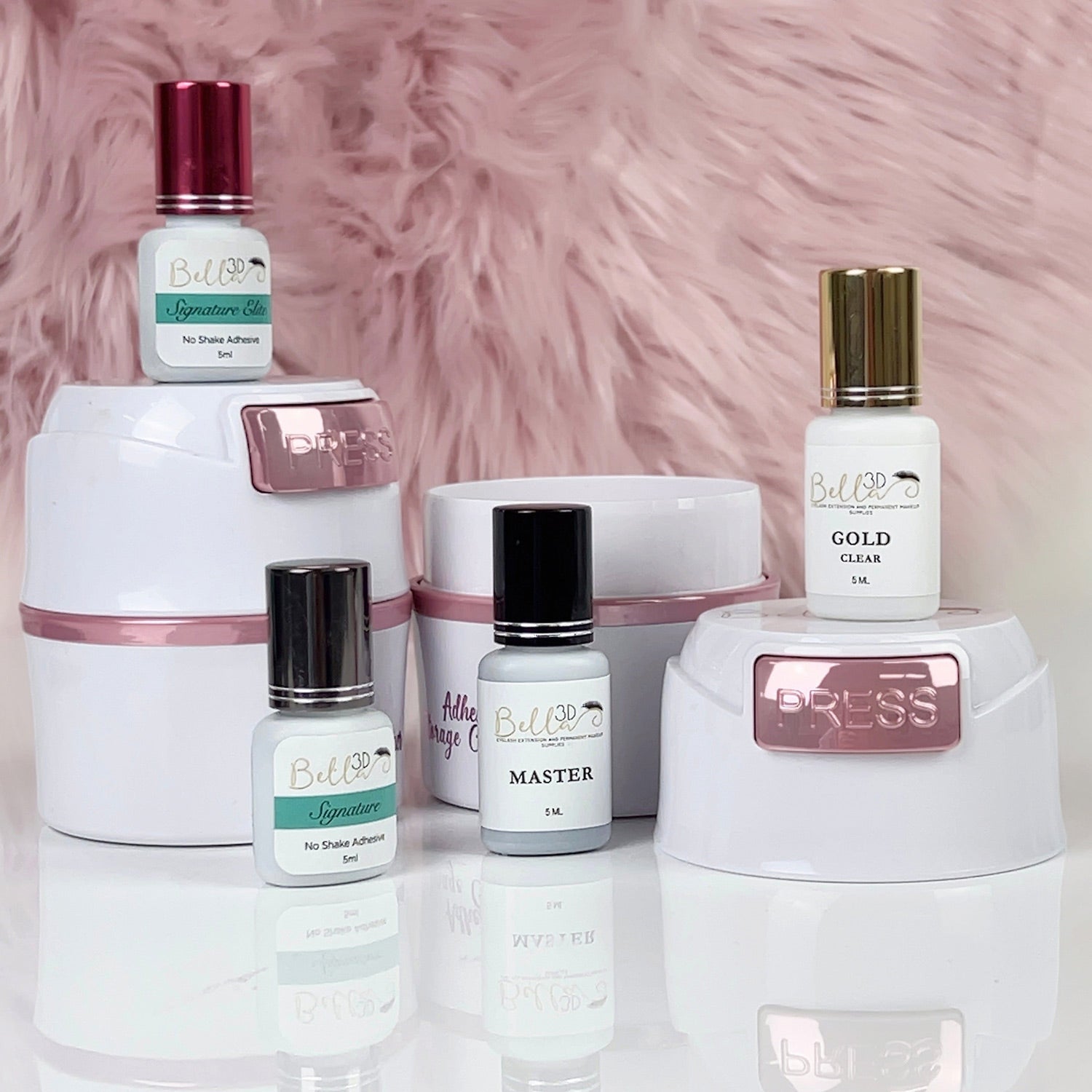 Adhesive Storage Container holding eyelash extension adhesive bottles and accessories on a reflective surface
