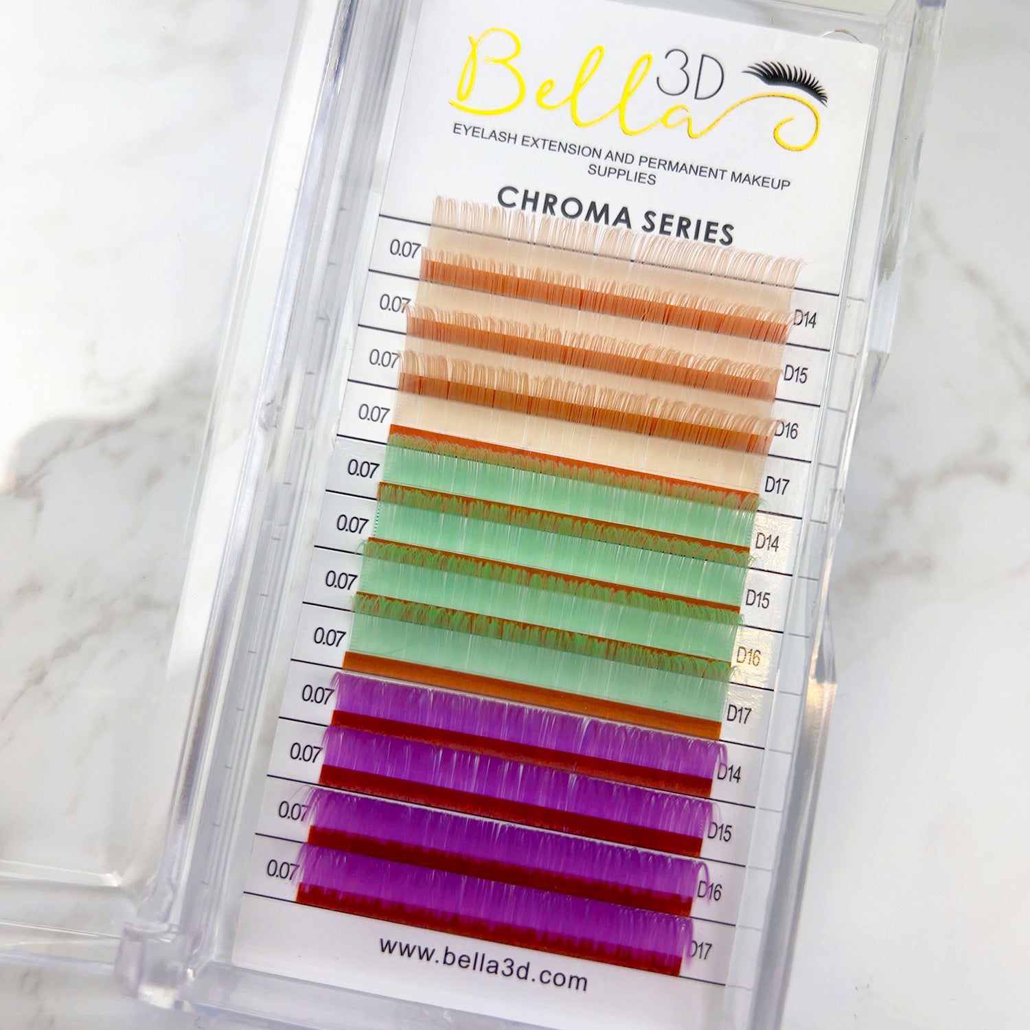 Chroma Mixed Trays - 0.07 multicolored eyelash extensions in orange, green, and purple shades in a clear case.