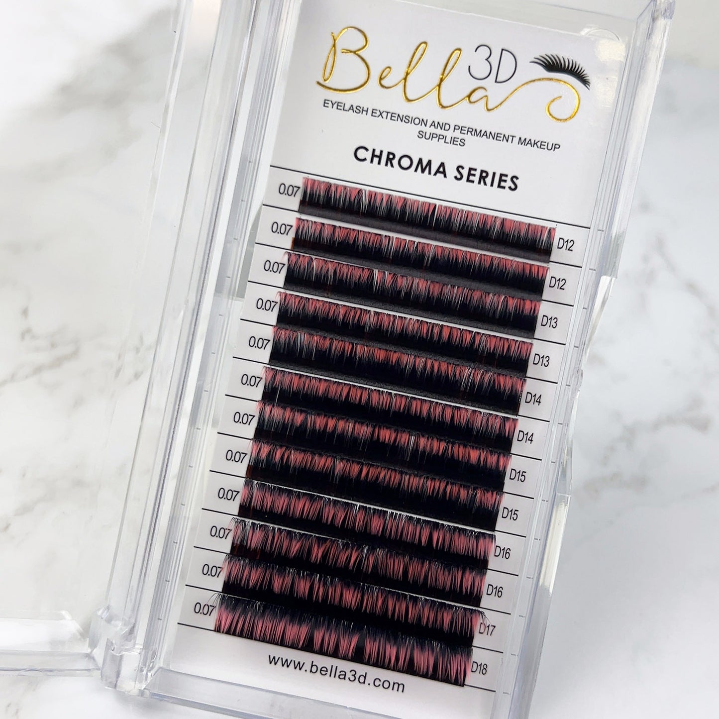 Bella 3D Chroma Ombré - 0.07 eyelash extensions with black and red ombré color in a clear display case