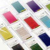 Multiple colorful trays of Chroma Series Colored Lashes - 0.15 eyelash extensions arranged in a flat lay display