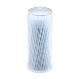 Disposable Micro Tip Applicators neatly arranged in a clear cylindrical container for precise eyelash extension adhesive application