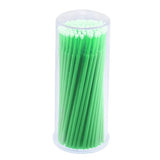 Disposable Micro Tip Applicators with green handles neatly packed in a clear cylindrical container for precision application.