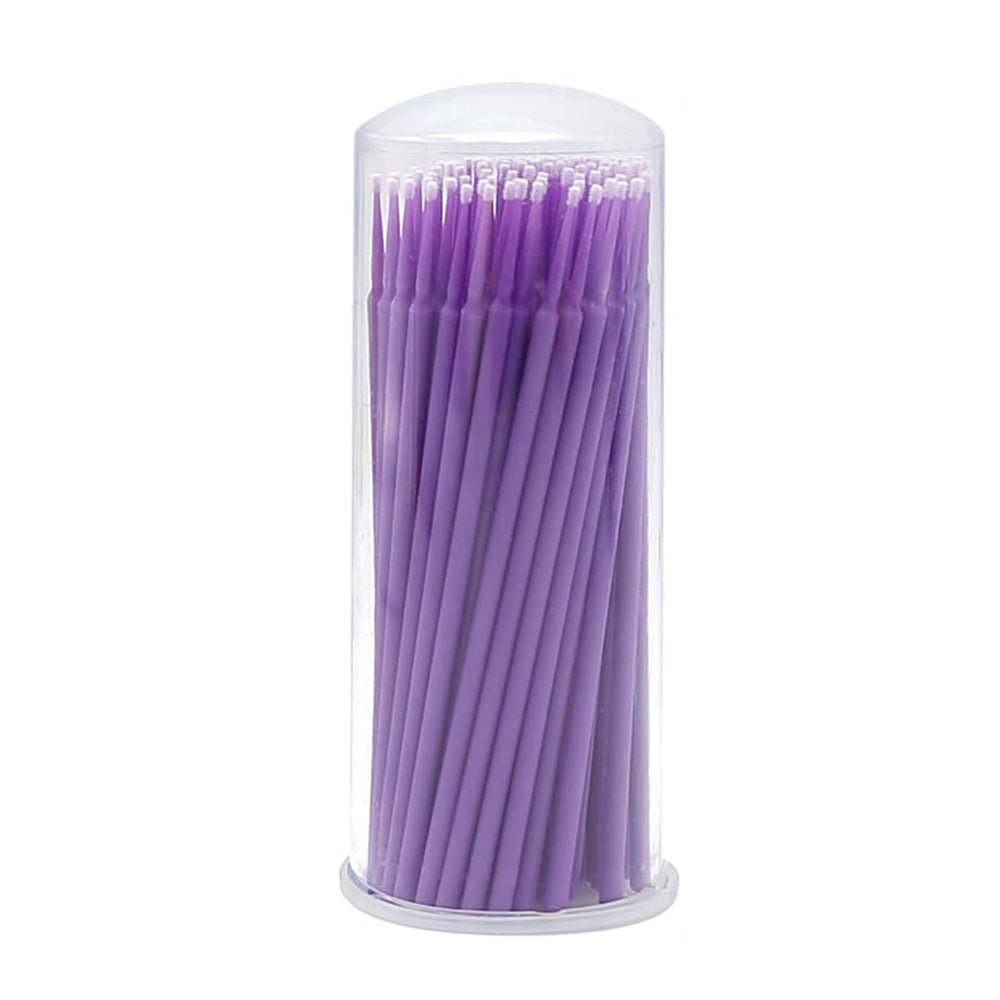 Clear container filled with purple Disposable Micro Tip Applicators used for precise application in eyelash extension accessories.