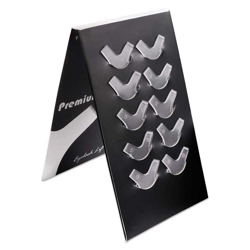 Dolly's Lash Lift - Y Brush Set featuring clear, curved lash lift shields displayed on black holder for eyelash extensions use