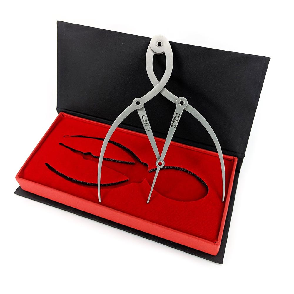 Eyebrow Steel Calipers with adjustable arms in a red and black protective case for precise eyebrow measurement.