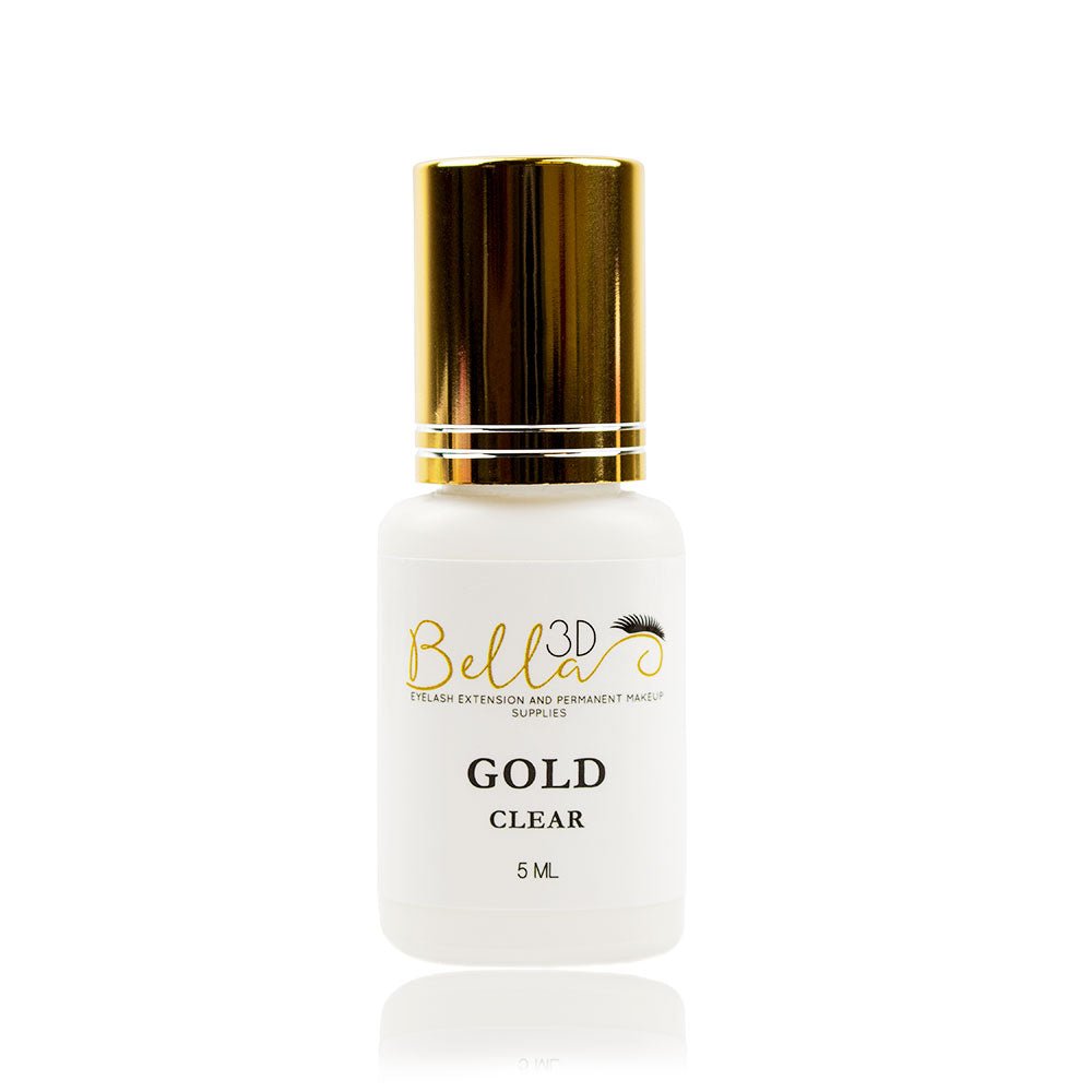 White bottle with a gold cap of Bella 3D Gold Adhesive for eyelash extensions and permanent makeup supplies