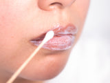 Tina Davies IceCream™ Topical Anesthetic applied carefully to lips with a cotton swab for numbing effect during procedures