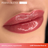 LUXE - Victorian Rose V2 glossy lip color on smooth, natural lips with a soft, elegant finish
