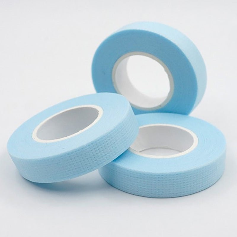 Three rolls of light blue Lint Free Micropore Tape used for eyelash extension accessories and microblading applications