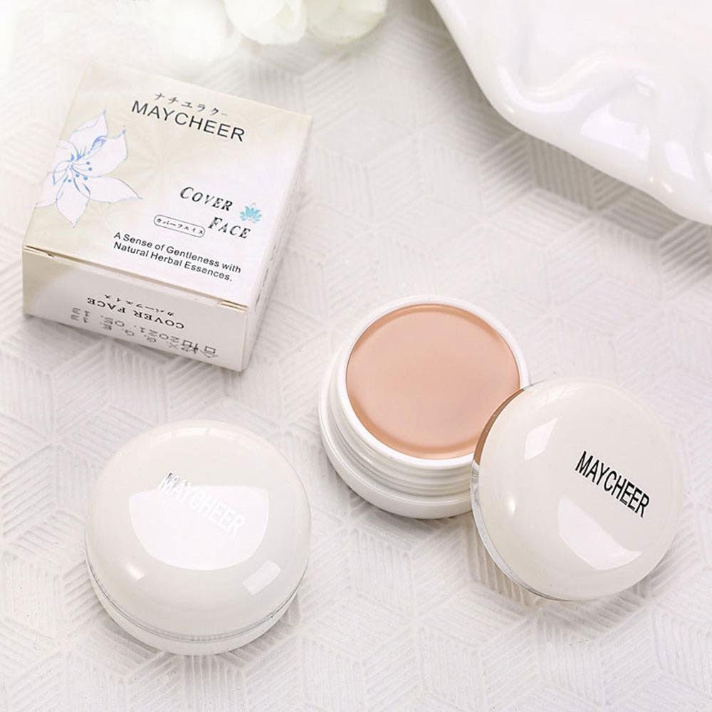 MAYCHEER Concealer in a round white container with a matching lid and a soft beige cream inside near its box packaging