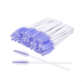 Mascara Wands with white handles and purple brush heads arranged in a bundle for eyelash extension use