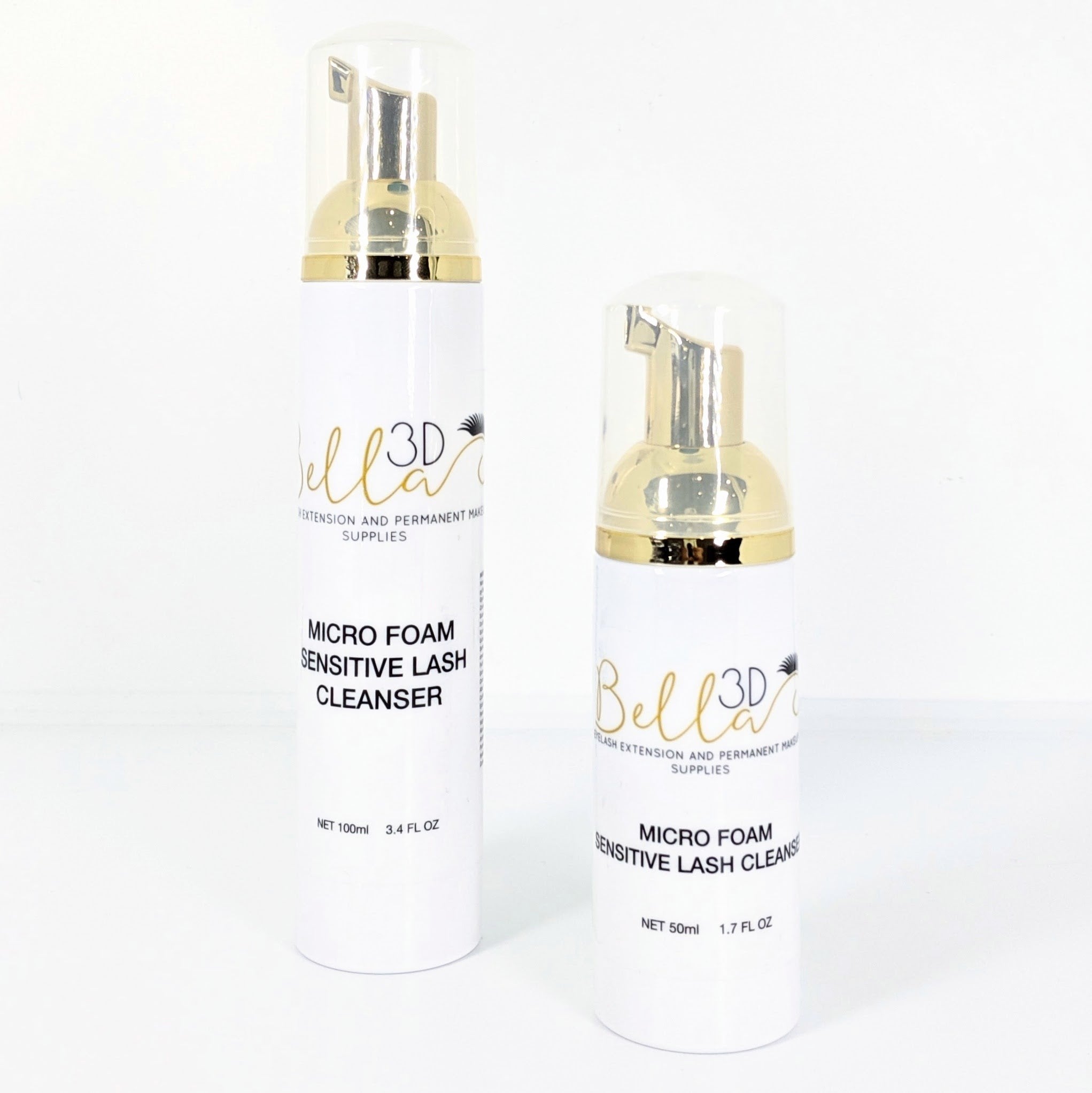 Two white bottles with gold pump dispensers of Micro Foam Sensitive Lash Cleanser for eyelash extension care.