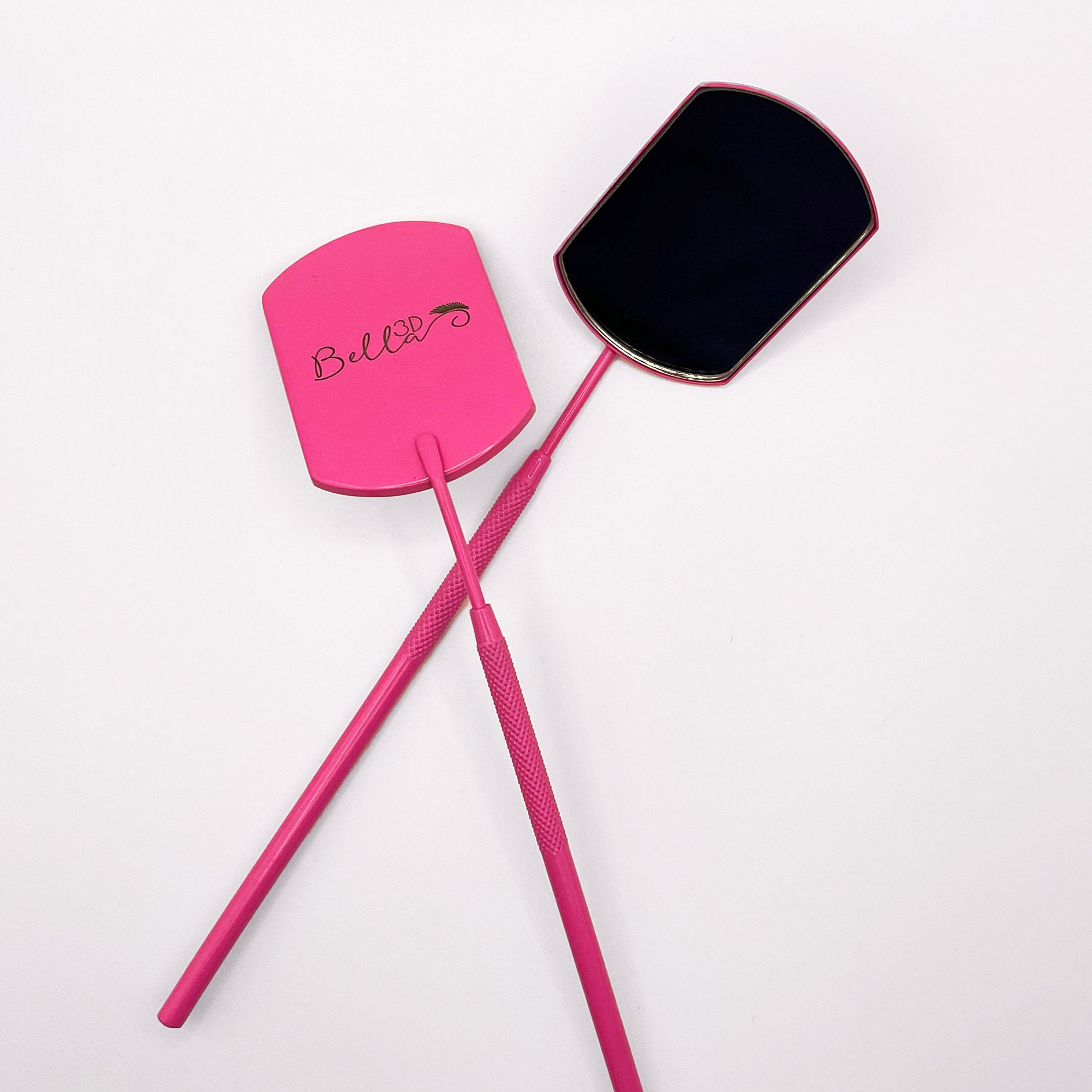Pretty Pink Lash Mirror with ergonomic handle, designed for eyelash extension application and precision tasks.