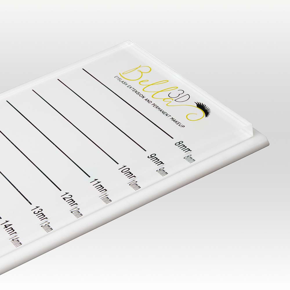 Protected Acrylic Lash Tile with length markings for eyelash extension accessories and adhesive application.