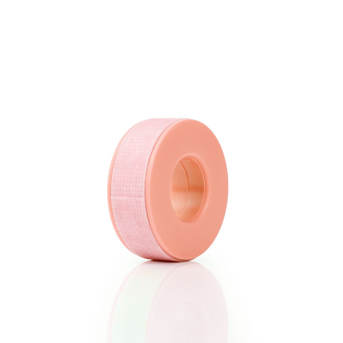 Sensitive Lash Tape roll in soft pink color designed for eyelash extensions and beauty treatments.