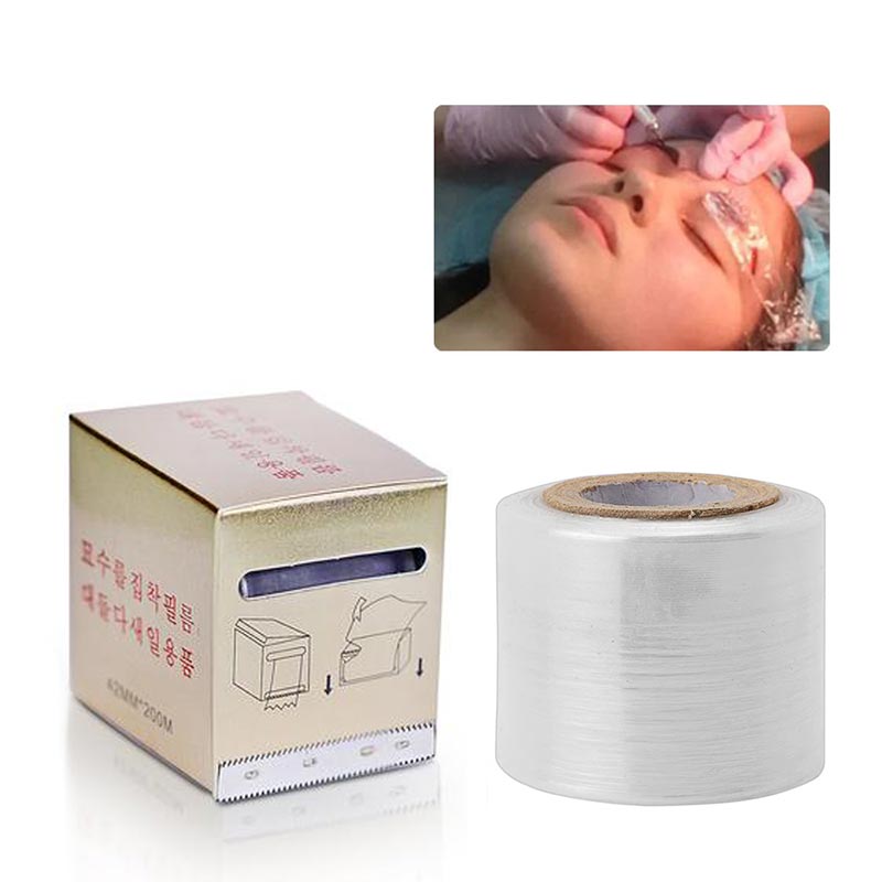Roll of clear Tattoo Plastic Film Wrap next to dispenser box with person receiving eyelash or microblading treatment