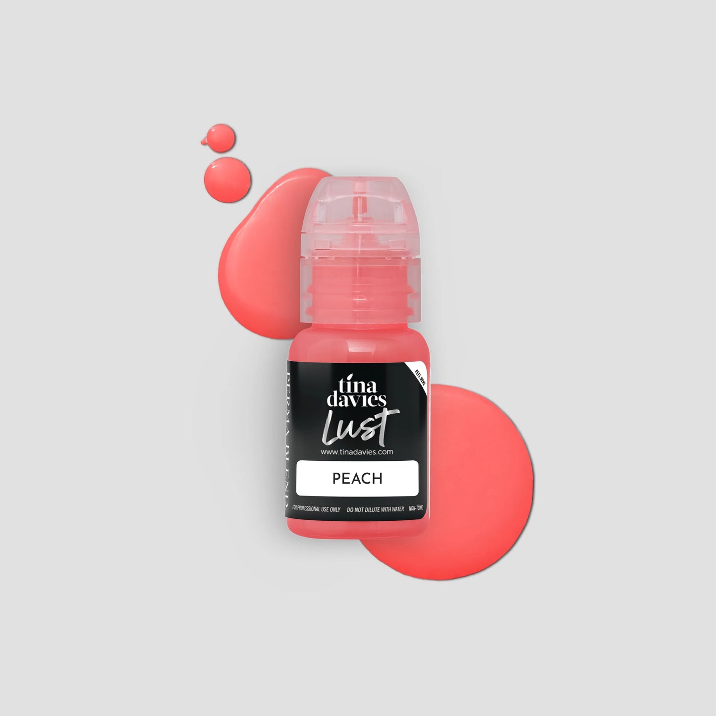 Bottle of Tina Davies Lust Peach color on a light gray background 
